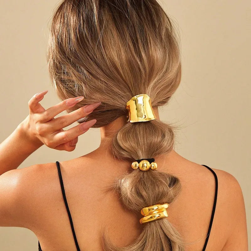 A Solid Gold Curved Hair Tie